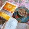 Panjeeri in a bowl while reading a book